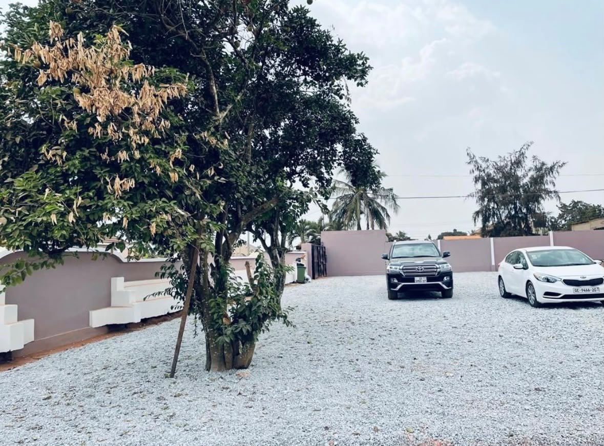 Spacious car park in the walled compound
